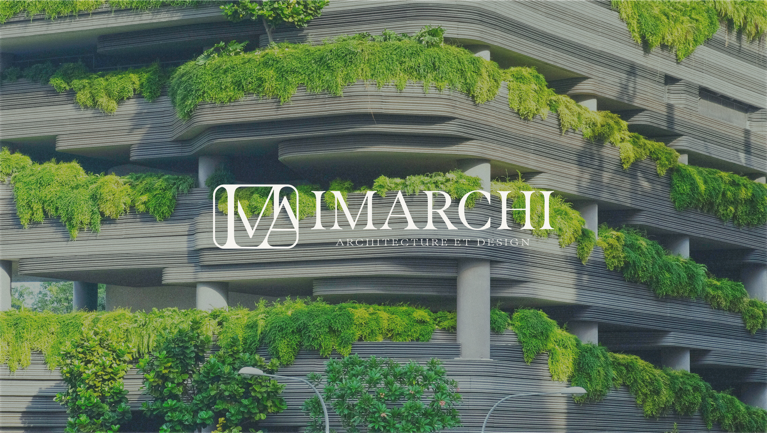 IMARCHI logotype applied to a planted building facade