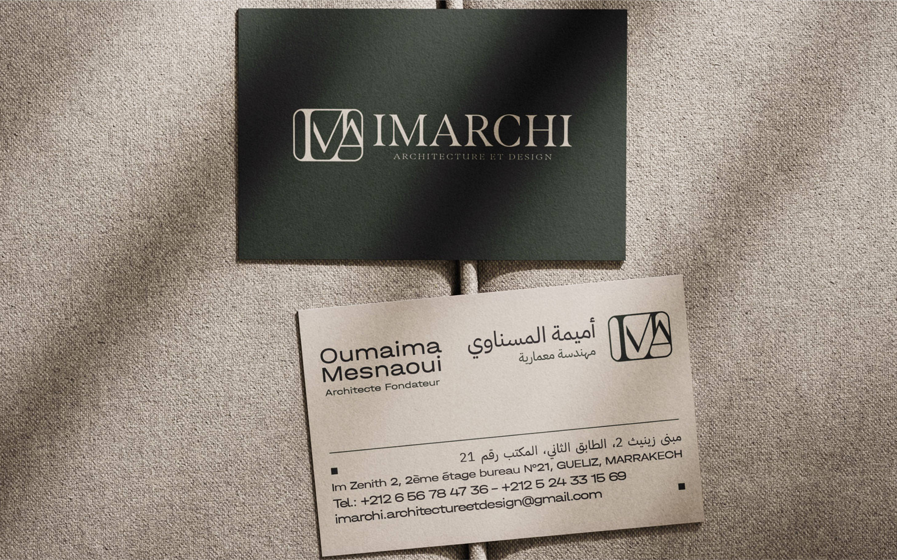 IMARCHI business cards and monogram on a dark surface